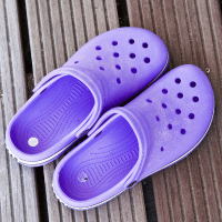 Pair of purple crocs.