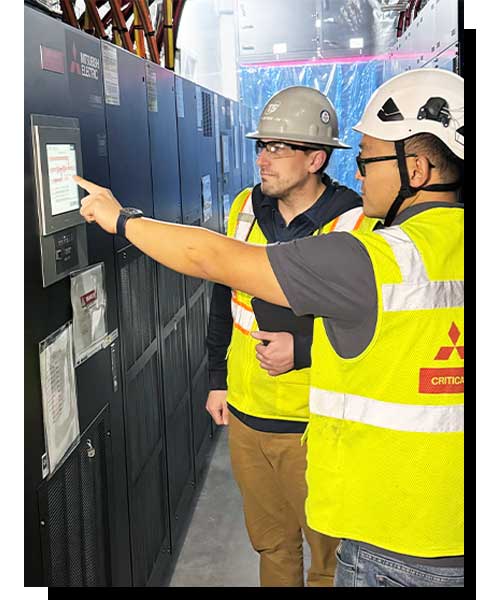 Photo of Field Service Tech with customer in front of UPS.