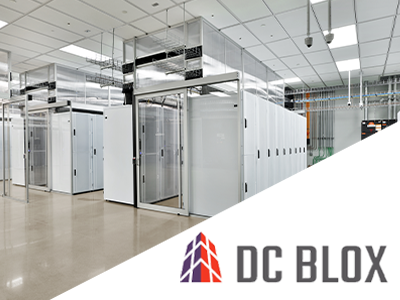 Inside a data center with DC Blox logo.