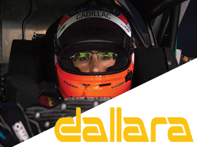 Man with helmet driving racecar with Dallara Logo.